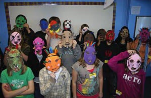 children with paper masks
