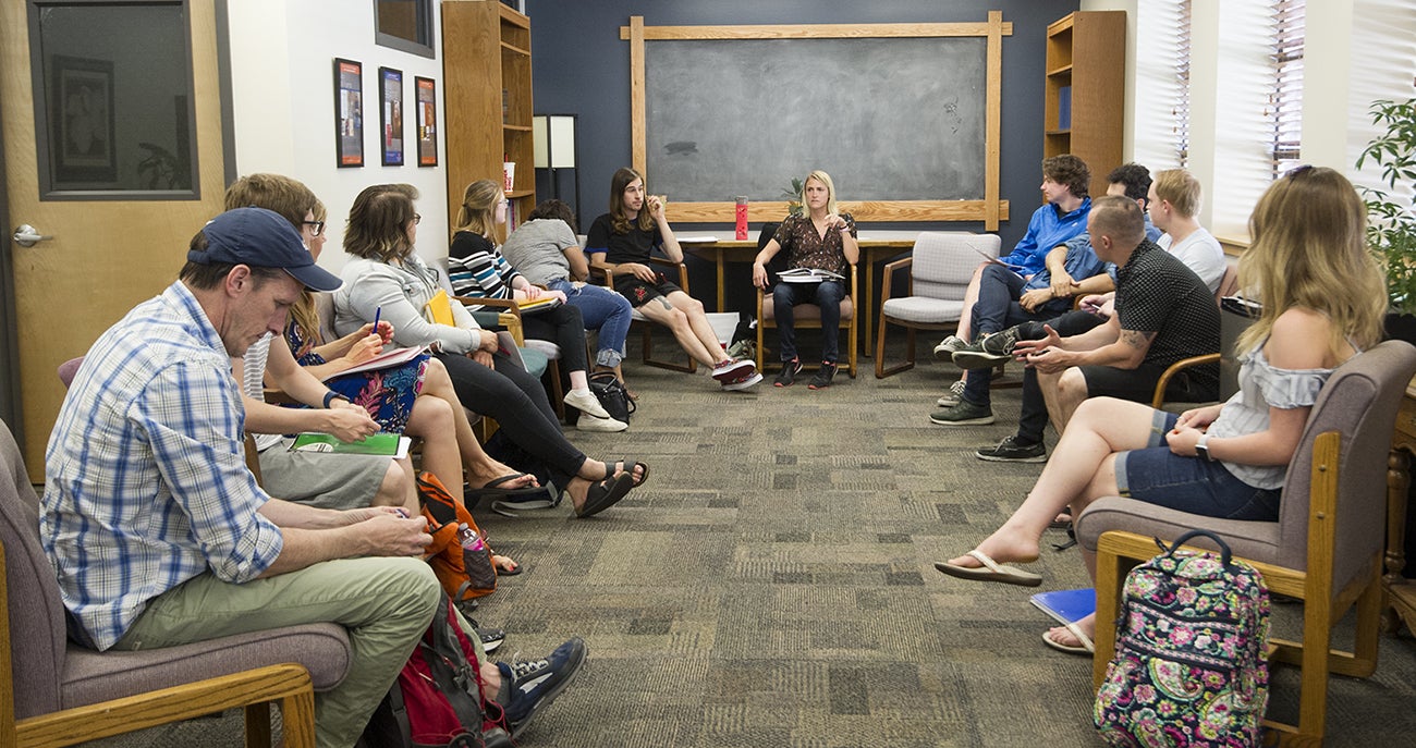 Faculty and students having a discussion 