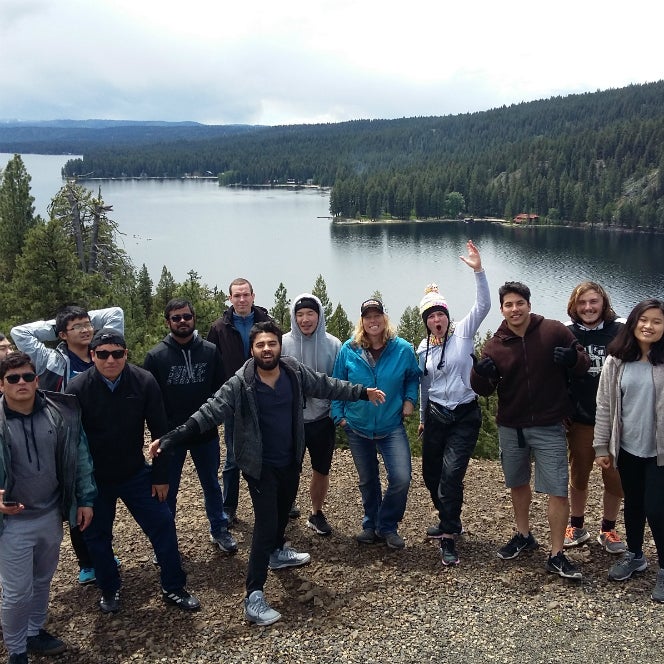 Photo of students by a lake