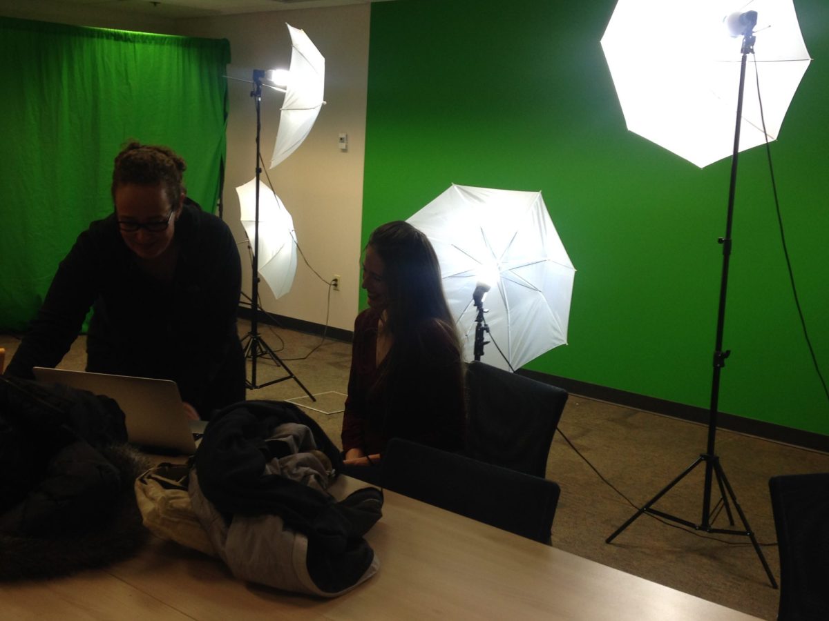 Team working with green screen and lighting