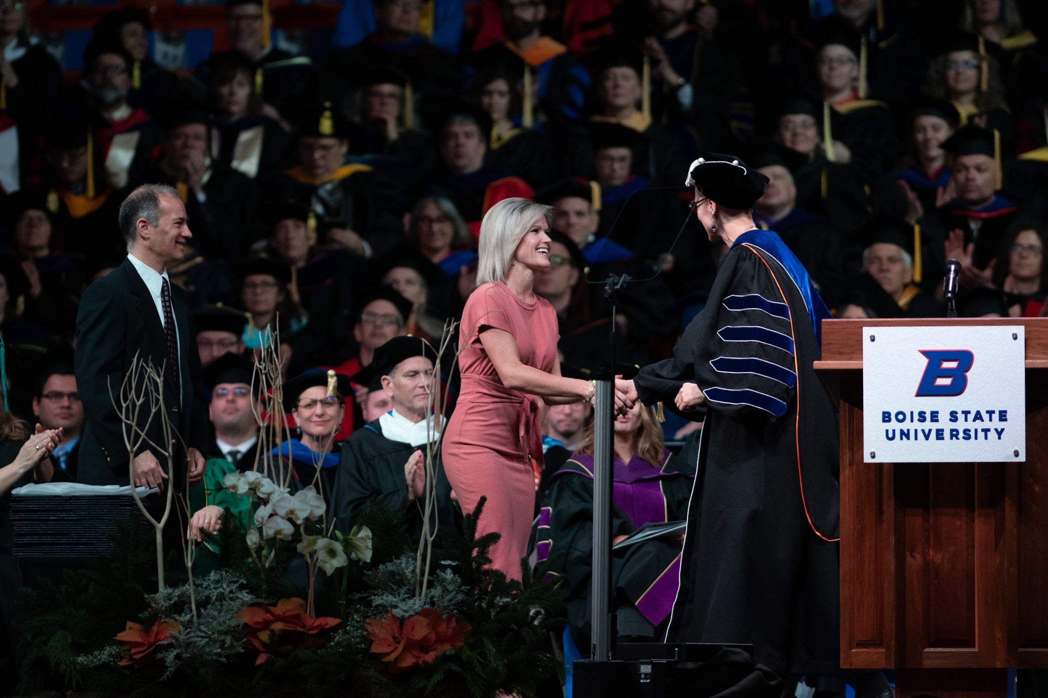 Taryn Waddell accepting award from Dr. Tromp