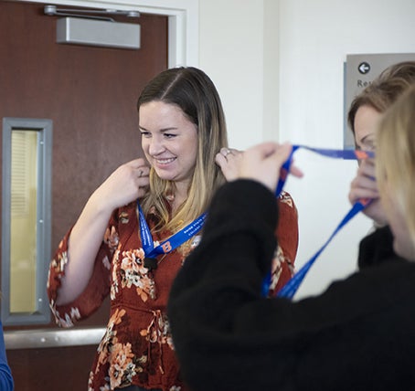 Student wearing lanyard at professional year orientation