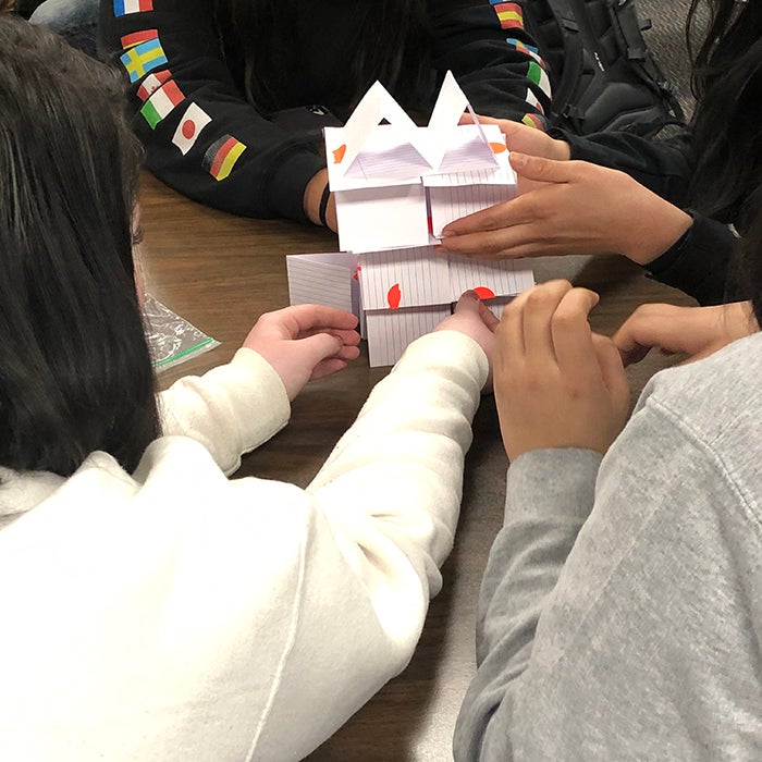 Students create a structure with cards