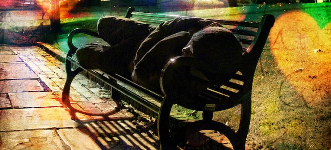 Person sleeping on bench