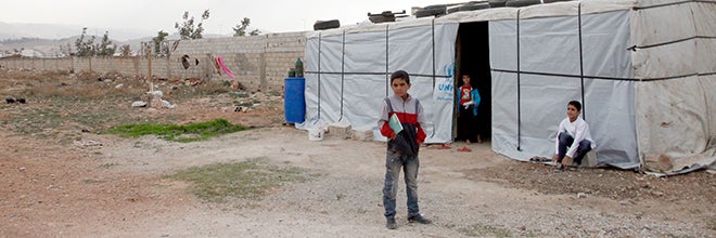 Syrian children outside temporary home in Lebanon’s Bekaa Valley