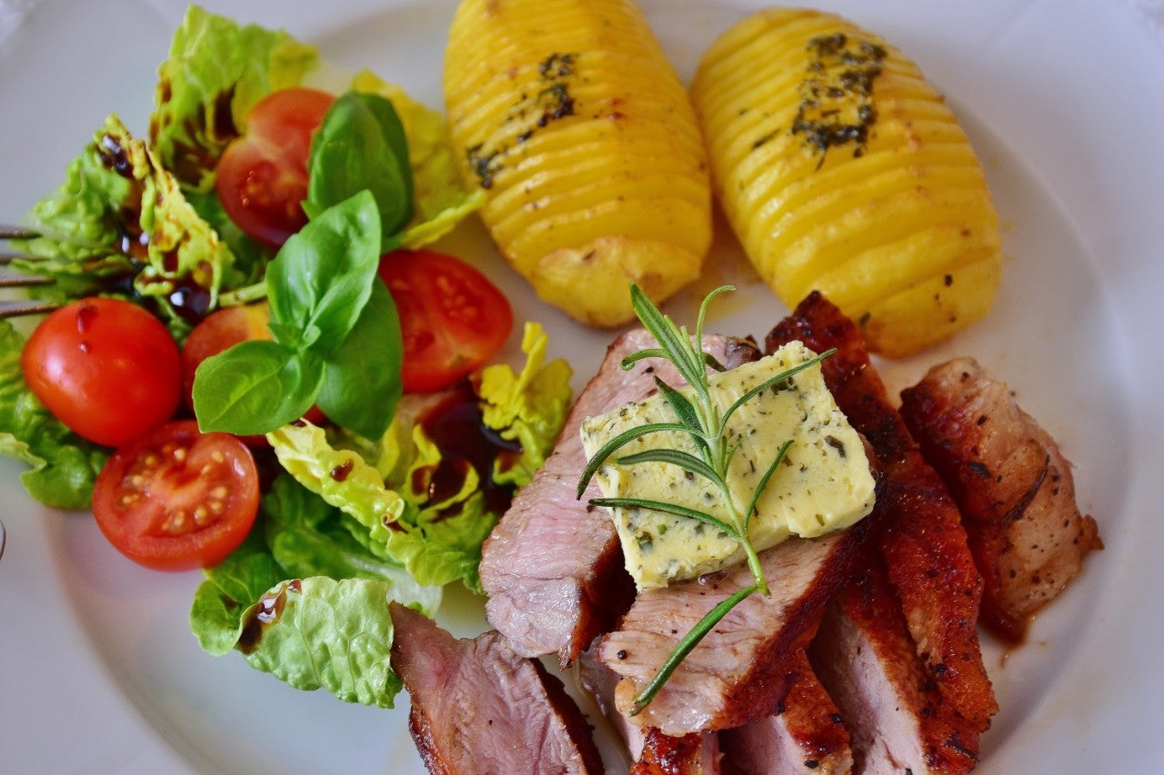 a healthy meal with meat, potatoes and salad