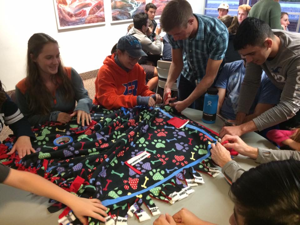 Students work together to make a blanket