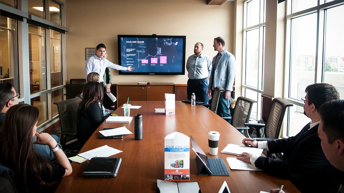 Students giving a presentation at the Venture College