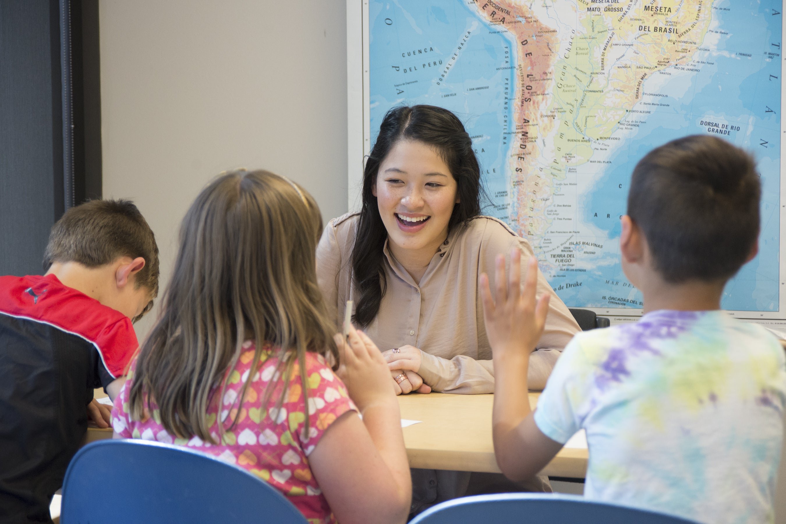 Teacher working with students