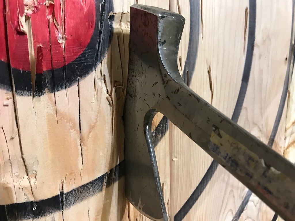 Axe in wood target, artist unknown