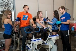 student perform exercise testing in Human Performance Lab