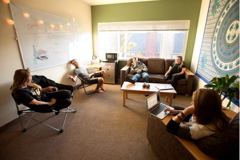 students casually talking in a community space.